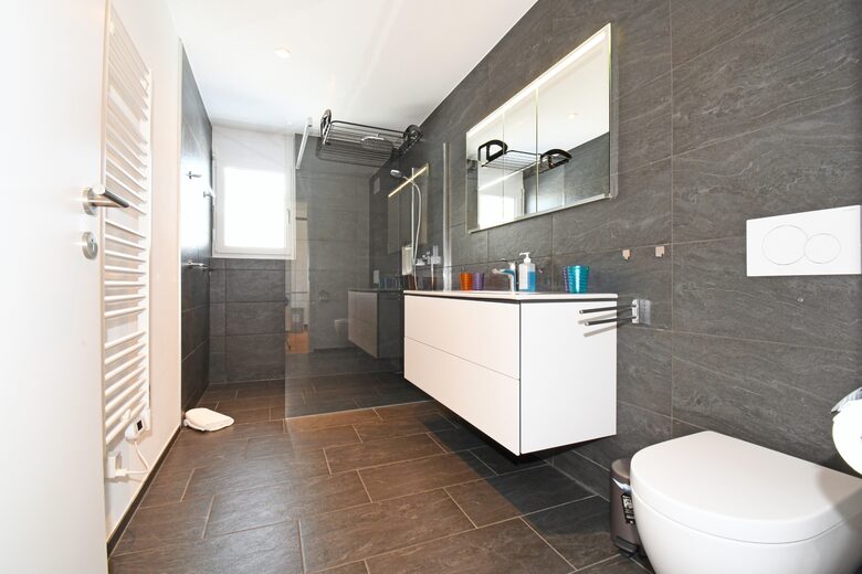 Large bathroom with a rain shower