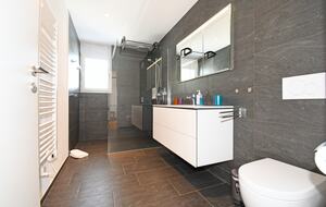 Large bathroom with a rain shower