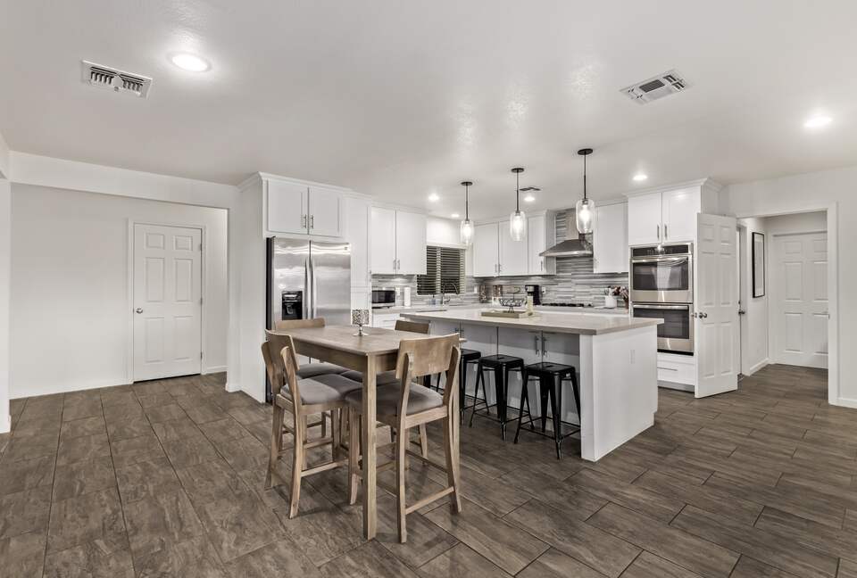 Lots of seating - 4 bar stools, table for 4 & dining for 6