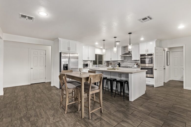 Lots of seating - 4 bar stools, table for 4 & dining for 6