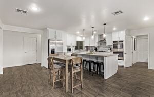 Lots of seating - 4 bar stools, table for 4 & dining for 6