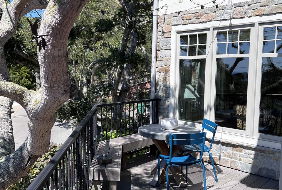 Smash deck with string lights off of kitchen and dining room