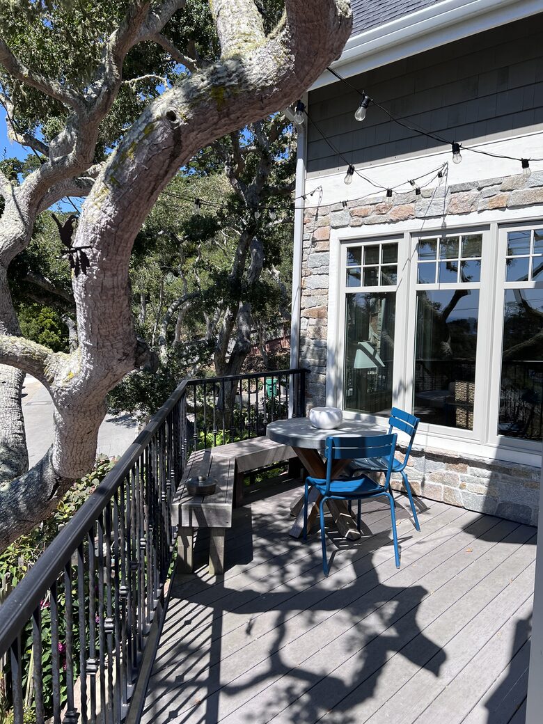 Smash deck with string lights off of kitchen and dining room