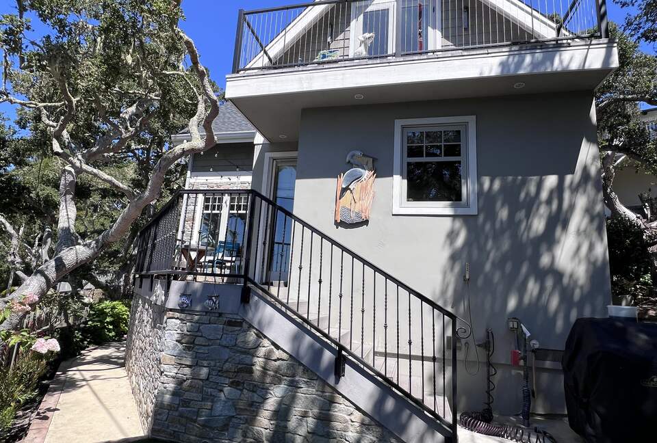 Back stairs lead to deck and kitchen