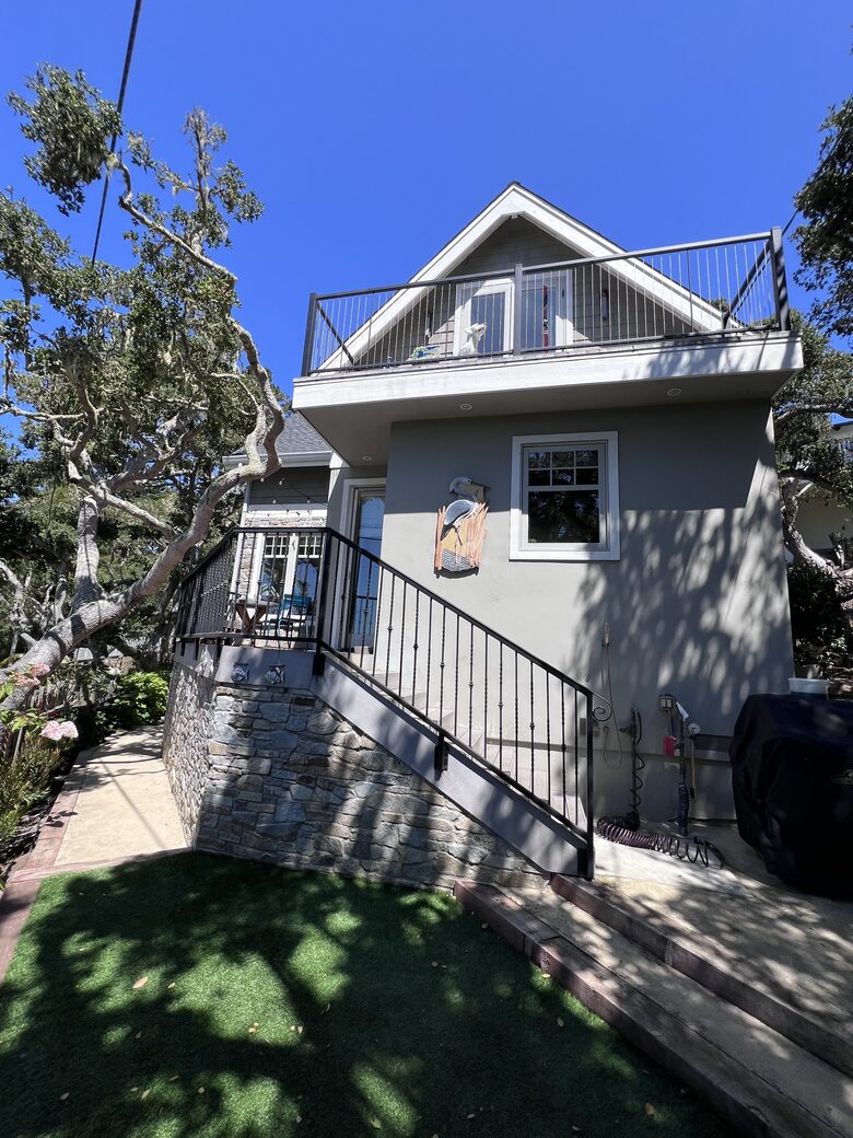 Back stairs lead to deck and kitchen