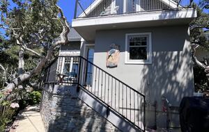 Back stairs lead to deck and kitchen