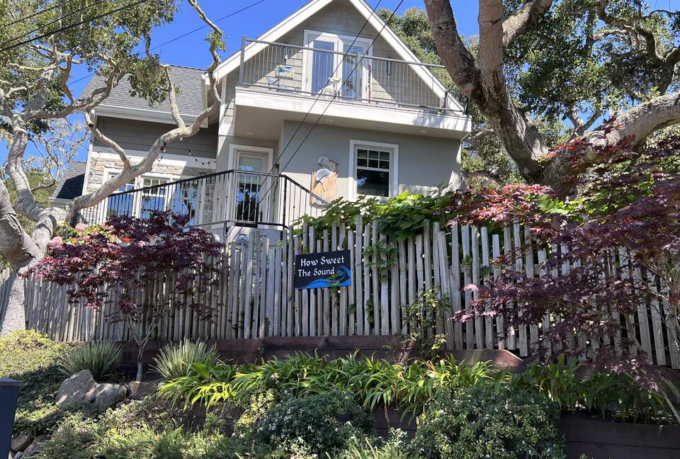 Looking up at kitchen and primary 2nd floor bedroom balcony