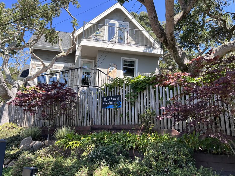 Looking up at kitchen and primary 2nd floor bedroom balcony