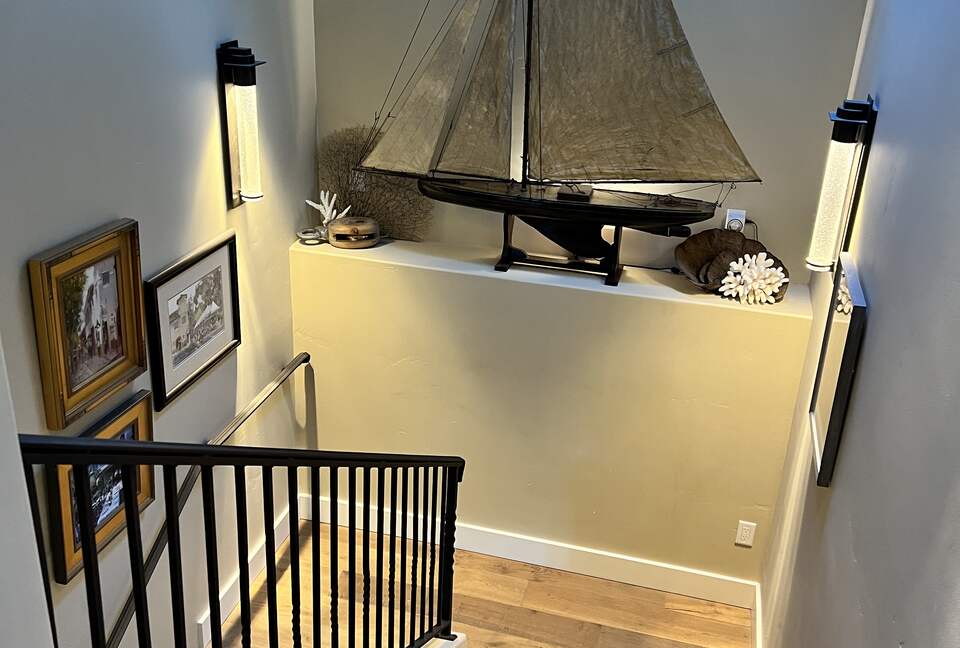 Looking down on antique English pond yacht, art walls