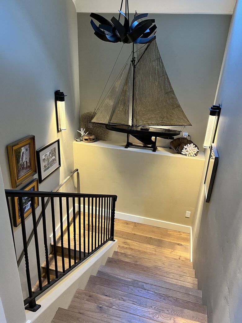 Looking down on antique English pond yacht, art walls