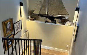 Looking down on antique English pond yacht, art walls