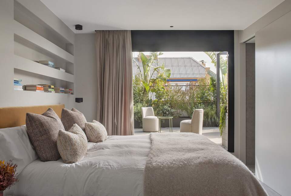 Primary Bedroom with accordion doors to outside