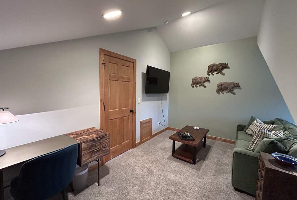 Bonus room with sofa bed and dedicated work space