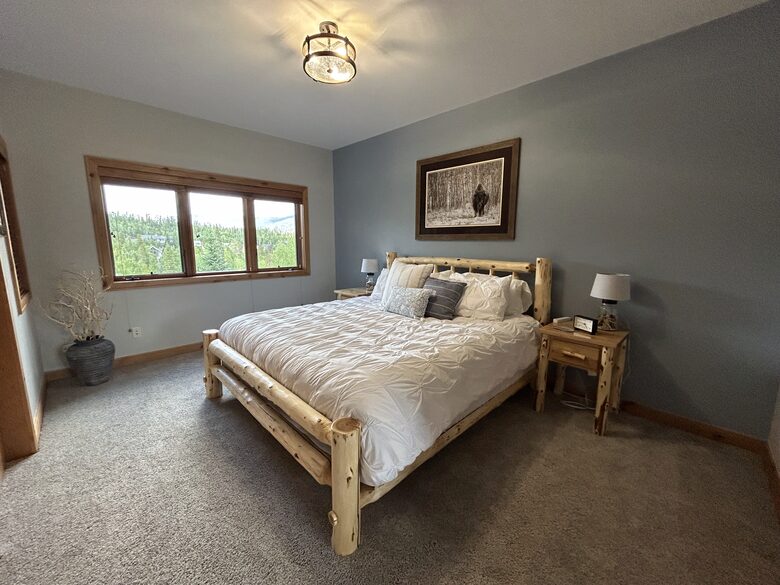 2nd bedroom with king bed and attached bath