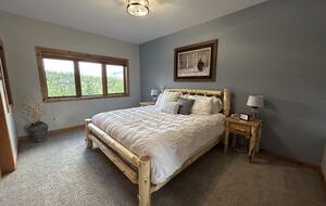 2nd bedroom with king bed and attached bath