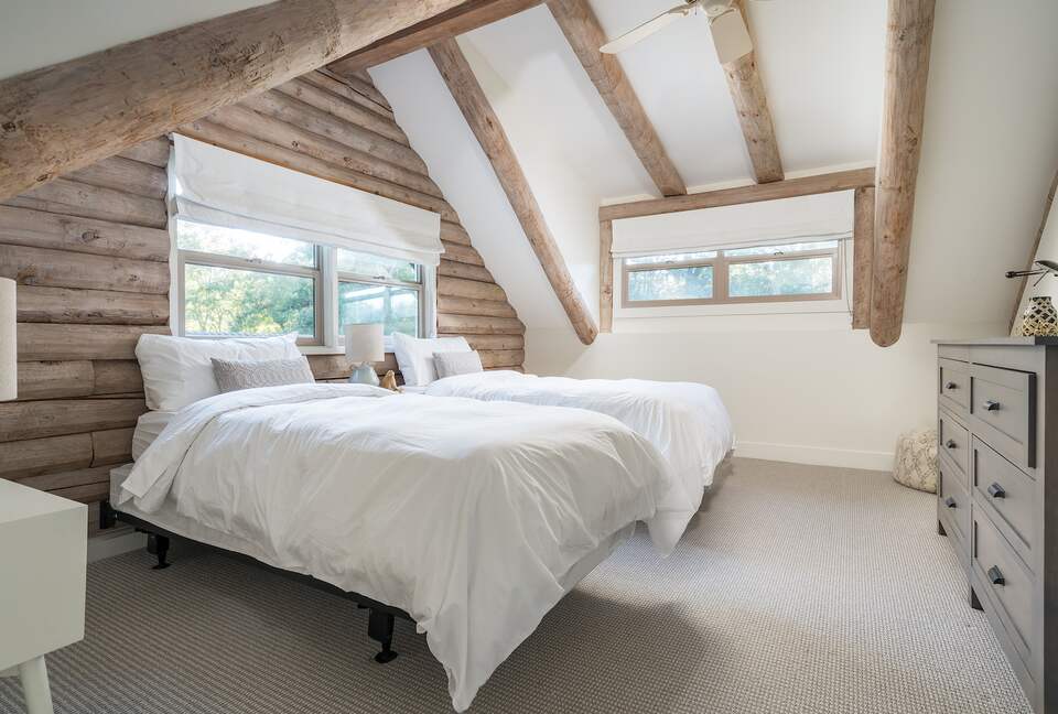 Upstairs bedroom shown as two twin XL