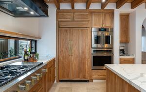 Six burner cooktop, SubZero refrigerator and double ovenss