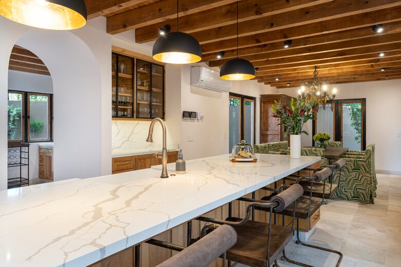 Bar area with icemaker off of kitchen