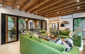 Living room overlooking patio and pool