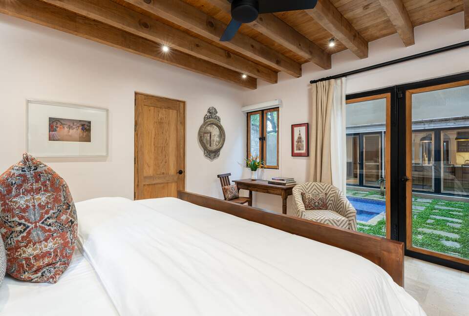 Guest bedroom overlooking the pool area