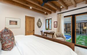 Guest bedroom overlooking the pool area