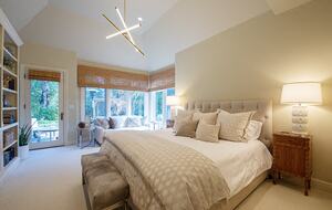 Primary bedroom with French door out to rose garden