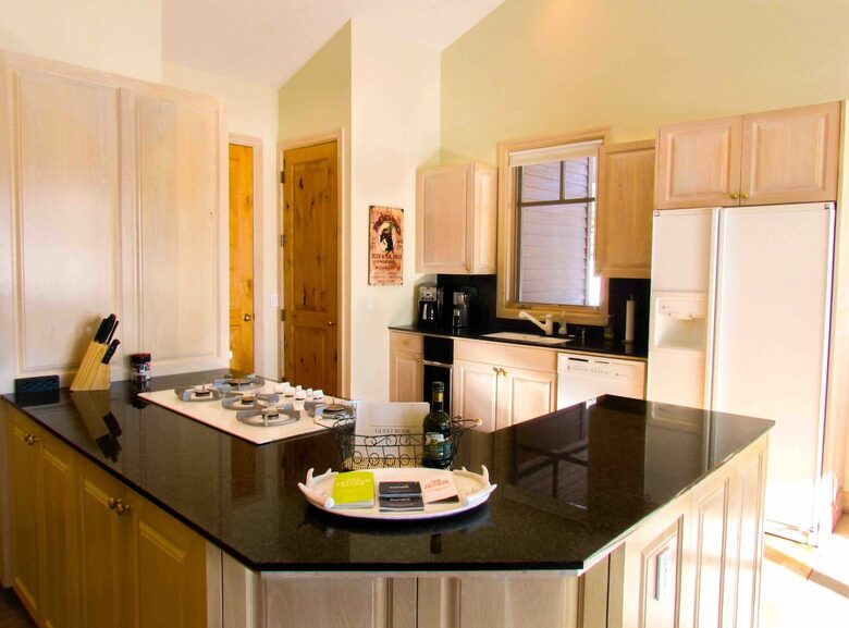 Kitchen with full appliances including coffee bean grinder and keurig