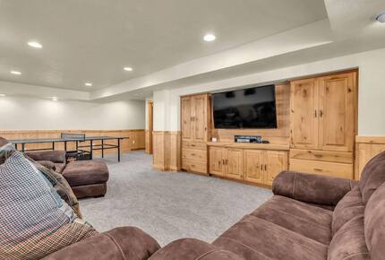 Basement with TV and ping pong table