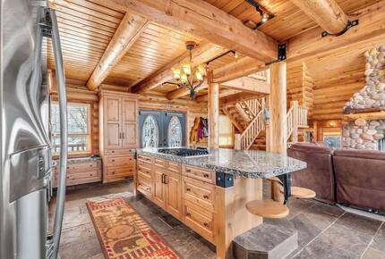 Kitchen island has stool seating for 5