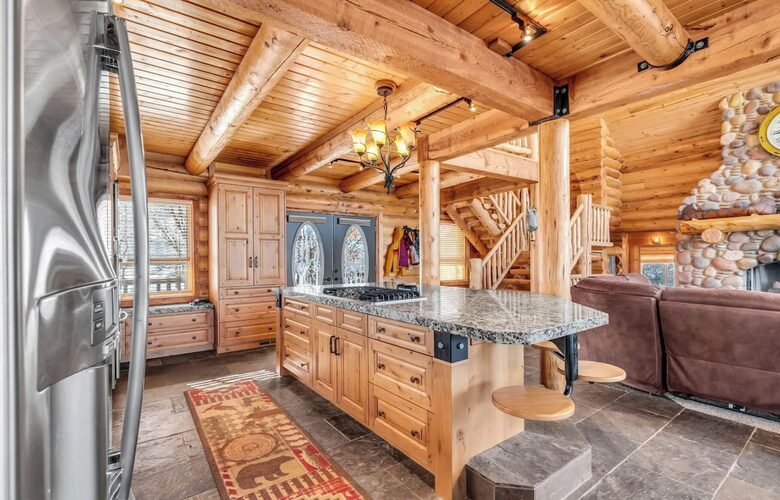 Kitchen island has stool seating for 5