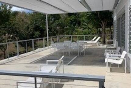 Balcony of the Casita with dining and loungers