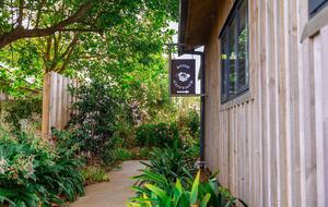 The cottage has its own entrance and stands-alone