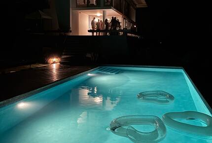 pool at night with lights on