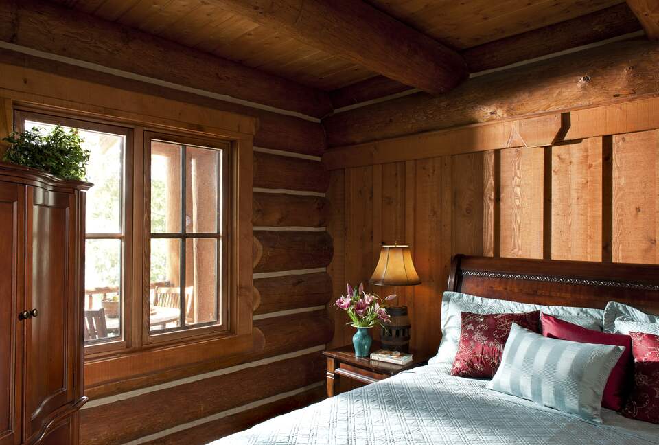 master bedroom looking out over deck and lake