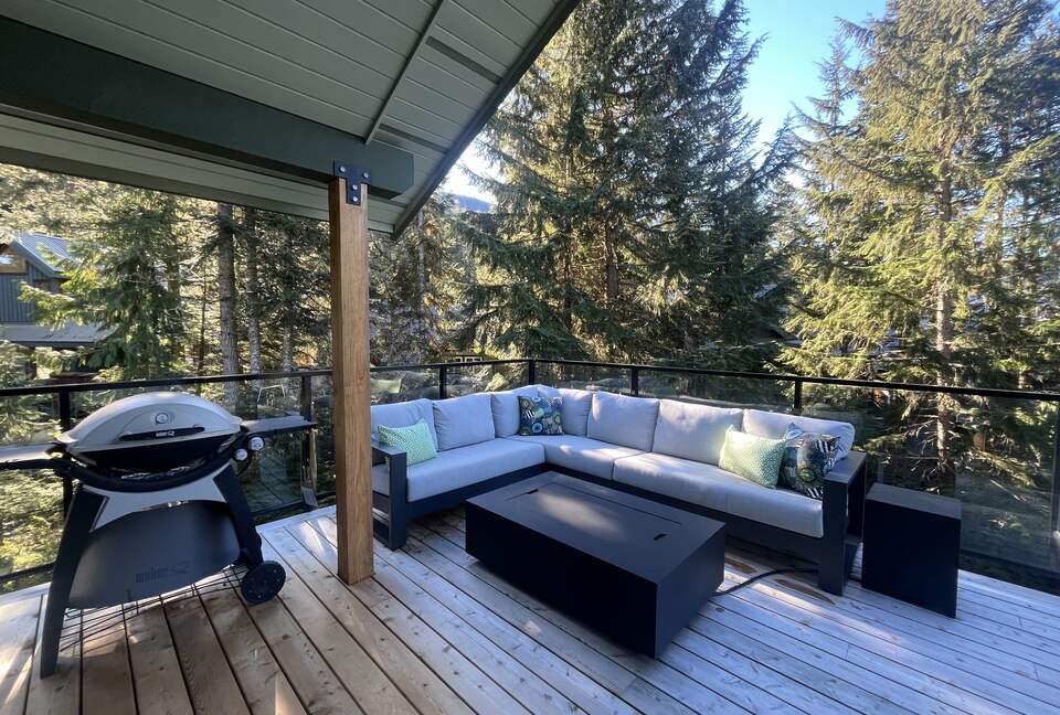 Upper deck - SW facing. Large sectional with, propane BBQ and firepit.