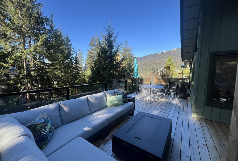 Looking west. Dining table and sun umbrella.