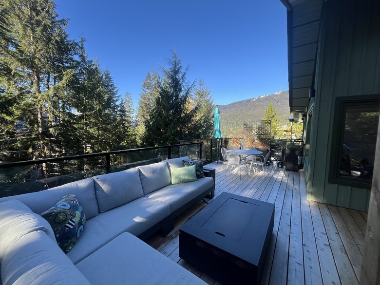 Looking west. Dining table and sun umbrella.