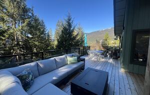 Looking west. Dining table and sun umbrella.