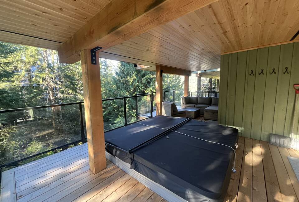 Lower deck with 8 person hot tub. Access from both lower bedrooms.