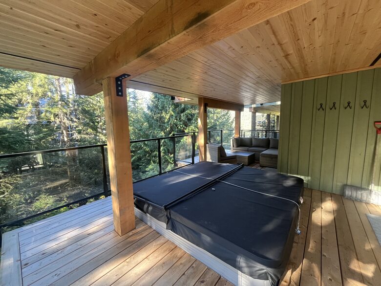 Lower deck with 8 person hot tub. Access from both lower bedrooms.