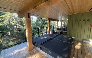 Lower deck with 8 person hot tub. Access from both lower bedrooms.