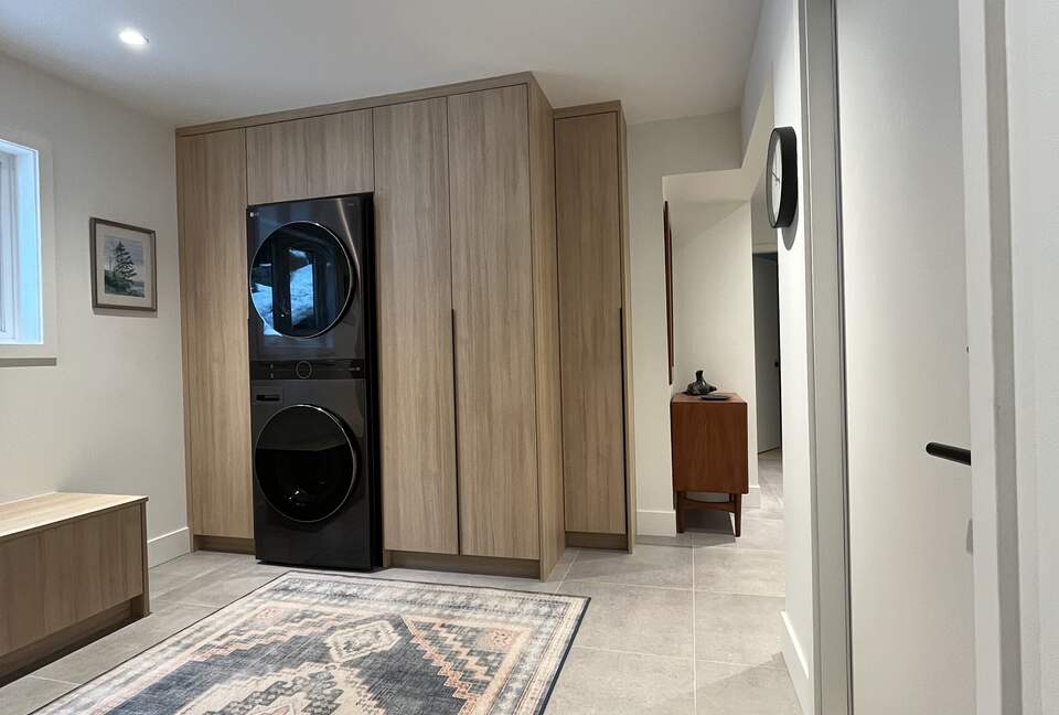Entry with new laundry centre and closets.