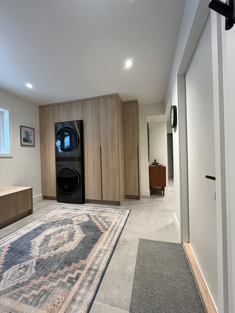 Entry with new laundry centre and closets.