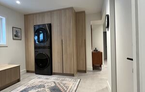 Entry with new laundry centre and closets.