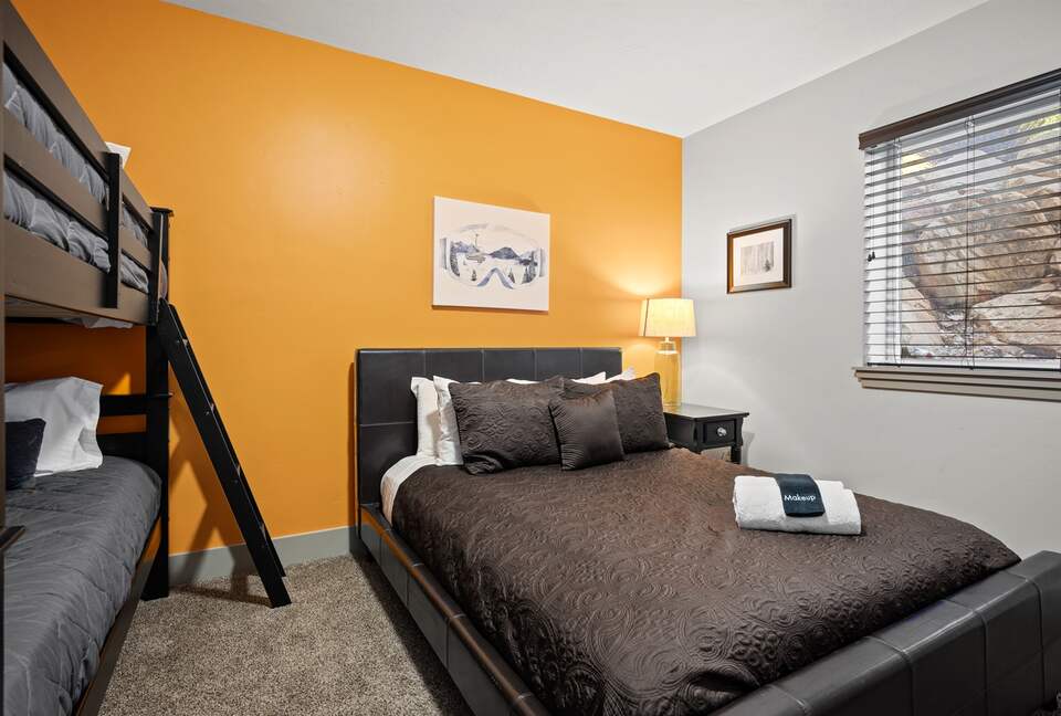 Downstairs bedroom - queen bed and bunk bed