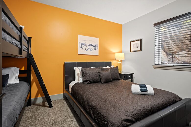 Downstairs bedroom - queen bed and bunk bed