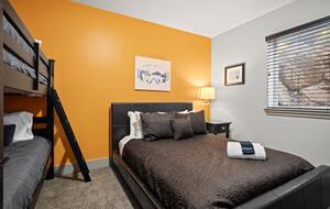 Downstairs bedroom - queen bed and bunk bed