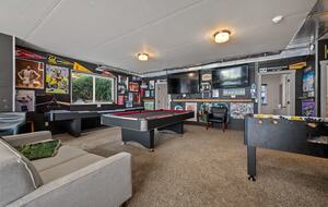Game room with billiards, foosball, shuffleboard, and ping-pong
