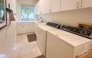 Laundry Room Adjacent to Garage