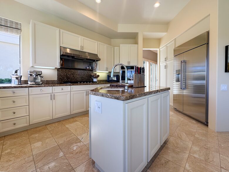 Sunlit Kitchen with Sleek Stainless Appliances